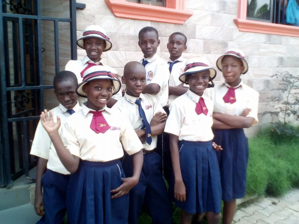 Happy Gifted Brains School students in uniform smiling together in Ibafo, Ogun State